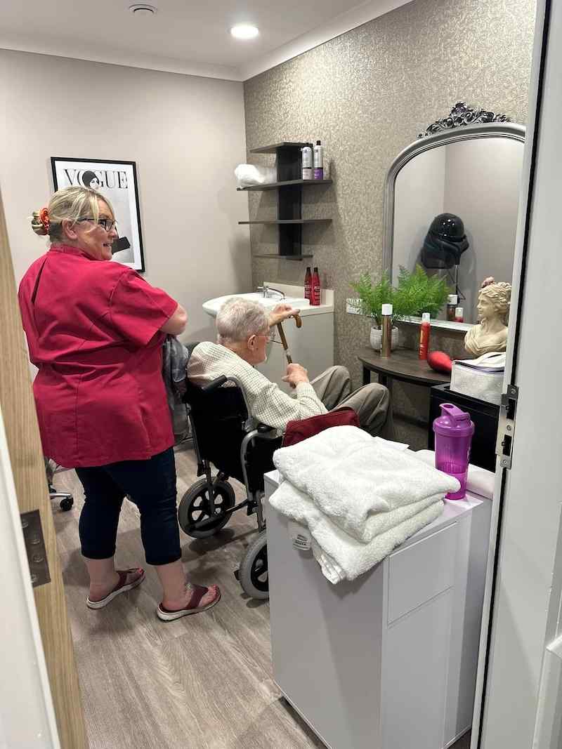 resident having their hair done